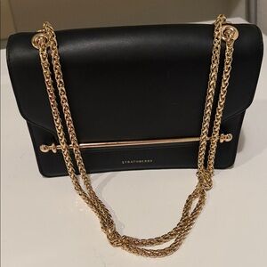 Strathberry Elegant Black Crossbody with Gold Accents east west bag